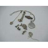Seven various silver charms, a silver bracelet, two silver lockets and a silver brooch (11), 1.5oz