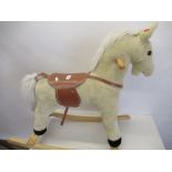 Child's soft toy rocking horse with press ear operated noise