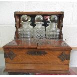 Edwardian oak and brass mounted three sectional decanter box with mirror back with fitted