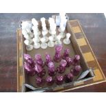 Glazed earthenware chess set complete with board