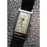 Rolex Prince hand wound wristwatch, chrome plated rectangular stepped case on black leather strap,