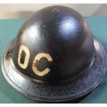 British WWII period "D.C" (decontamination) steel helmet with liner and chinstrap