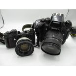 Nikon F4 auto focus SLR camera with Nikon MB23 grip, and a Sigma 28 - 200 autofocus lens (some