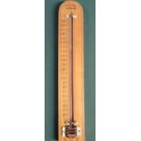 A GWR thermometer stamped GWR Dollond London with replacement tube