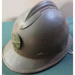 French WWII period Adrian patent helmet with artillery badge to the front, complete with liner and