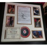 Framed and mounted montage of Robbie Williams "Rock DJ" with signed score (A1 sporting items COA)