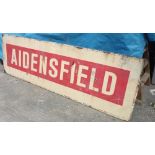 A large wooden and plastic railway station sign for Aidensfield attributed to the Heartbeat TV