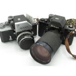 Nikon F2 black body with a Vivitar 28-200mm lens, (camera untested but does appear to work) and a
