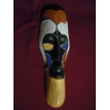 A African tribal mask with elongated features and multi coloured design approx 50cm long