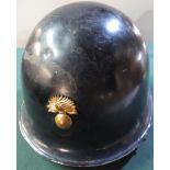 Possible Belgium steel helmet in black finish with leather chinstraps and later added front