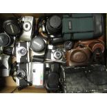 Collection of various cameras including: Nikon FG, Olympus 35EC, Olympus trip 35, Canon Eos 300,