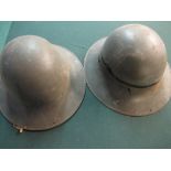 Two British late WWII period steel helmet civilian type