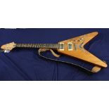 Flying V (Gibson copy) electric guitar with solid mahogany body in natural finish, glued mahogany