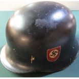 German WWII period steel helmet with later hand painted SS decals (lacking liner and chinstrap)