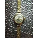 Rotary ladies wrist watch hallmarked 9ct gold case on bark effect bracelet with snap on back. Rotary