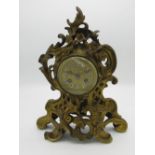 20th C Ricco design brass cased mantle clock with gilt dial applied porcelain cartouche numerals,