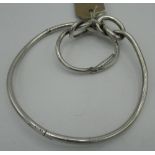 Suite of silver jewellery of knot form comprising, bangle, necklace and ring (size K), stamped (3)