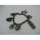 Sterling silver charm bracelet including purse, ship in a bottle, car etc stamped 925 1.5ozt