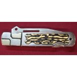 American stainless steel handle and blade pocket knife with ornate design and plastic handle grip