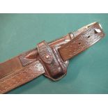 Quality tooled leather belt with brass buckle marked Harry Boden, with side pouch with an early