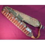 Brown leather shotgun cartridge belt with thirty cartridge loops and pressed button coverings