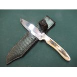 Harry Boden sheath knife with 4 1/2" blade with two piece sambar horn grips and tooled leather