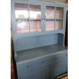 Vintage kitchen dresser with two glazed door above two drawers and two panelled doors on square