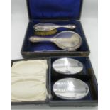 Hallmarked sterling silver dressing table set of two brushes and mirror, cased Birmingham, 1921