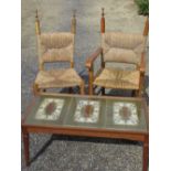 Pair of beech framed open armchairs with rush seats and backs and a teak rectangular coffee table,