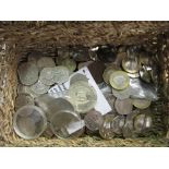 Small wicker box containing a selection of various 50p & £2 including: Tales of Peter Rabbit,