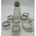 Three pairs of cut glass jars with hallmarked Sterling silver collars and rims, a large cut glass