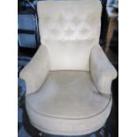 Victorian style club chair, with button back, out scrolled arms and bow seat upholstered in old gold