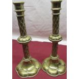Pair of ecclesiastical style brass altar candlesticks, cast checkered knot stems on shaped bases