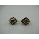 Pair of 14ct yellow gold garnet set earrings