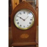 Edwardian inlaid mahogany lancet cased timepiece with white Roman dial and brass ball feet, H23cm,