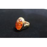 Hallmarked 9ct gold and Amber ring Size O gross 6.5g