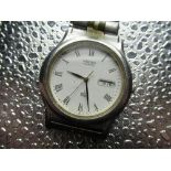 Seiko SQ quartz wristwatch with day date, stainless steel case on original bi-metallic bracelet snap