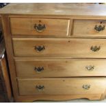 Edwardian satin walnut chest of two short above three long moulded drawers with brass handles on