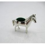Silver pincushion in the form of a horse stamped Sterling