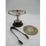 Foreign silver sugar tongs, a hallmarked sterling silver cup and a hallmarked sterling silver