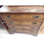 C19th Geo. I style feather and crossbanded walnut chest of four long graduated cockbeaded drawers,