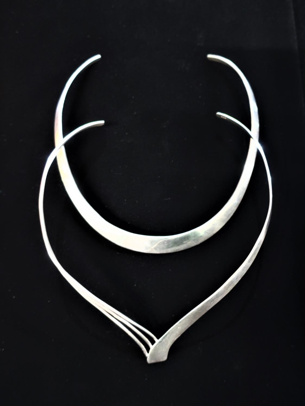 Silver collar necklace with two part design stamped 925 and another similar silver collar necklace