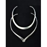 Silver collar necklace with two part design stamped 925 and another similar silver collar necklace