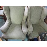 Pair of Geo.III style wing back chairs, with out curved arms and loose seat cushions on scroll