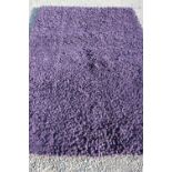 Extremely large purple woolen rug