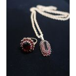 Hallmarked 9ct gold garnet halo ring Size N gross 4.7g and a 9ct gold rope chain necklace with