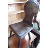 Victorian oak hall chair with axehead back and shaped seat, on four turned outsplayed supports