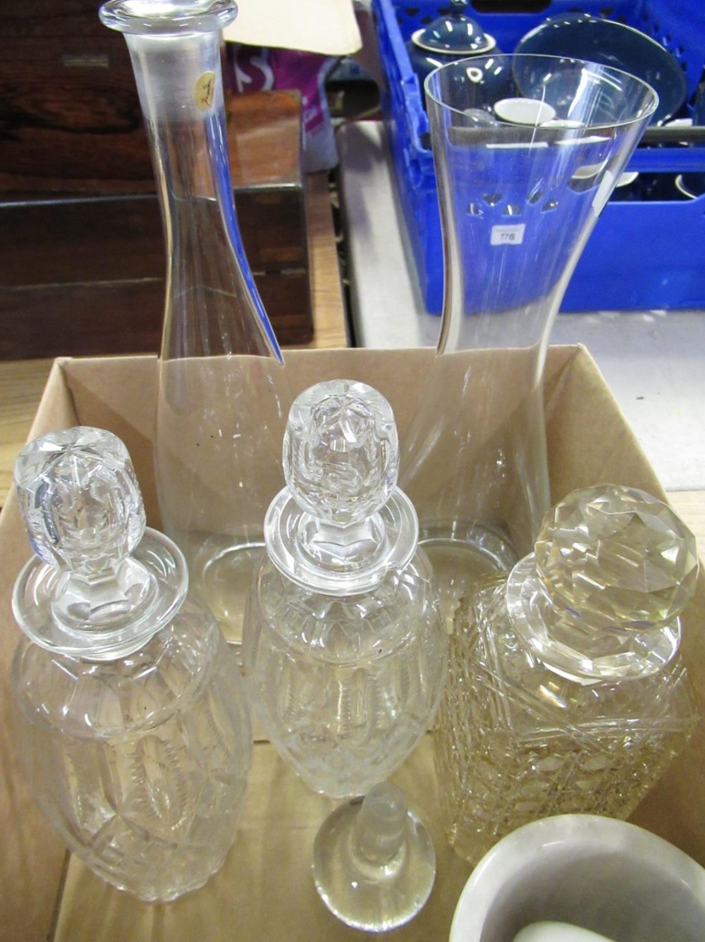 Pair of glass decanters, another square cut decanter, and two wine carafes