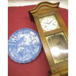 Victorian style oak cased chiming wall clock and 20th C Chinese blue and white charger with
