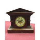 Early 20th C mantle clock in medium oak architectural case, brass bezel enclosing ceramic dial, twin